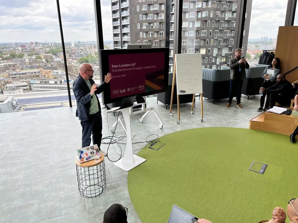 Theo Blackwell presenting at the standards and strategic leadership meeting hosted in the AWS offices