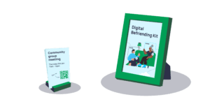 Tickets with QR codes on a stand, next to a photo framed digital befriending kit