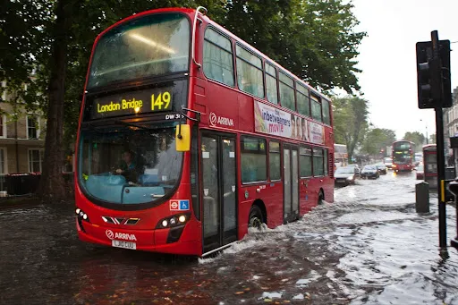 London bus driving through flood water