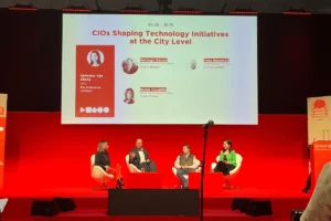 Theo Blackwell, Chief Digital Officer for London speaking on a panel with three other people at the Smart City Expo World Congress in Barcelona