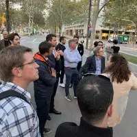 A group of people looking on a walking tour of the innovation district in Barcelona