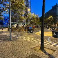A street that has been pedestrianised and has a children's playground on the road instead of cars