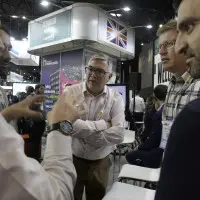 LOTI members taking part in the London networking event A photo of three people in conversation at the SCEWC