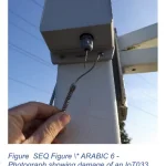 A photo of a sensor with someone holding onto a wire that has been disconnected from another wire